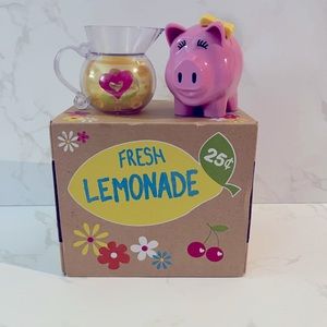 American Girl Lemonade stand with pitcher and piggy bank.